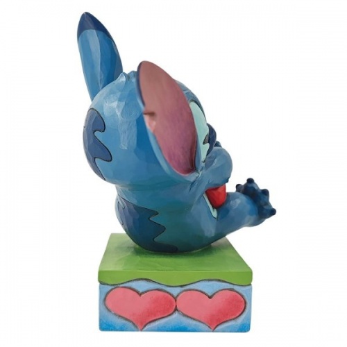 Disney Traditions Stitch Hugging a Heart Figurine